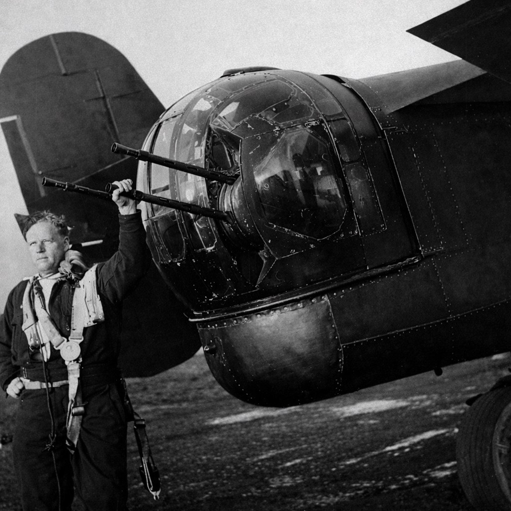 Ken Oakes beside the nose turret of a Halifax bomber